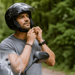 putting on a motorcycle helmet