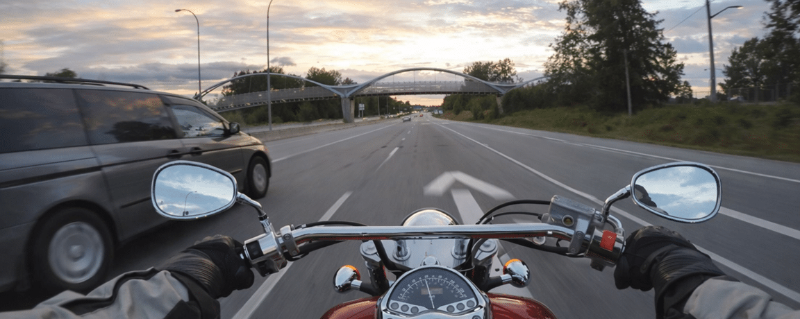 A motorcycle in a merge lane
